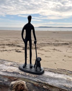 Dog And Their Owner Figure