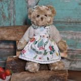 Teddy Bear In A Berry Dress And Cardigan