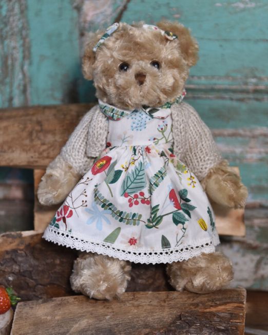 Teddy Bear In A Berry Dress And Cardigan